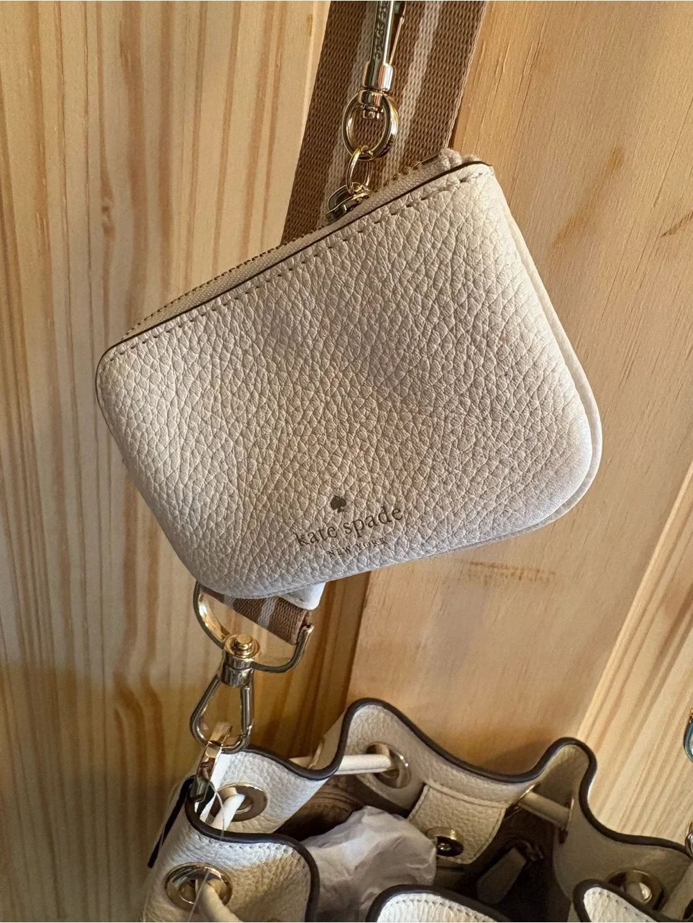 kate spade Cream Pebbled Leather Drawstring Crossbody with Striped Strap